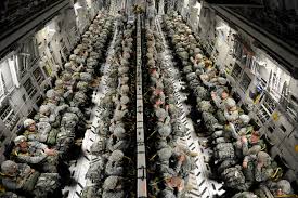 soldiers packed in c130